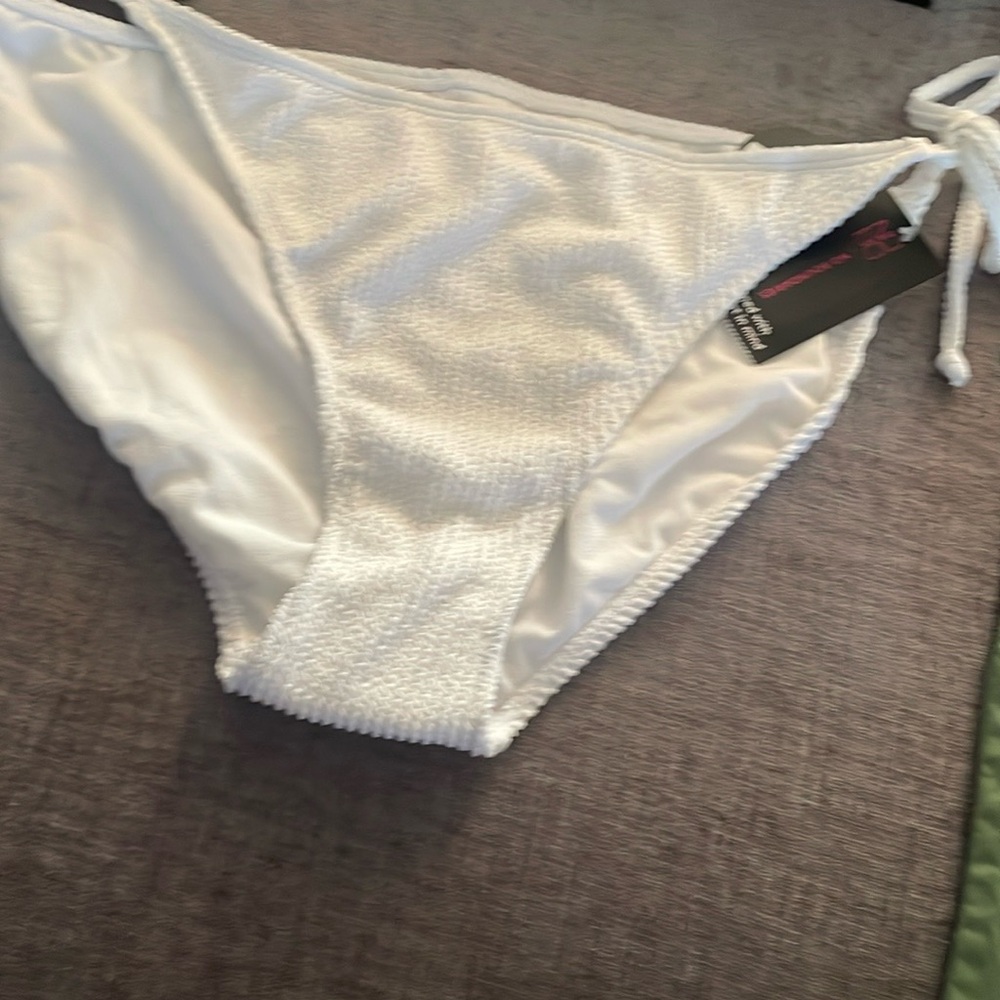 Two Bikini bottoms , new never worn , tags .